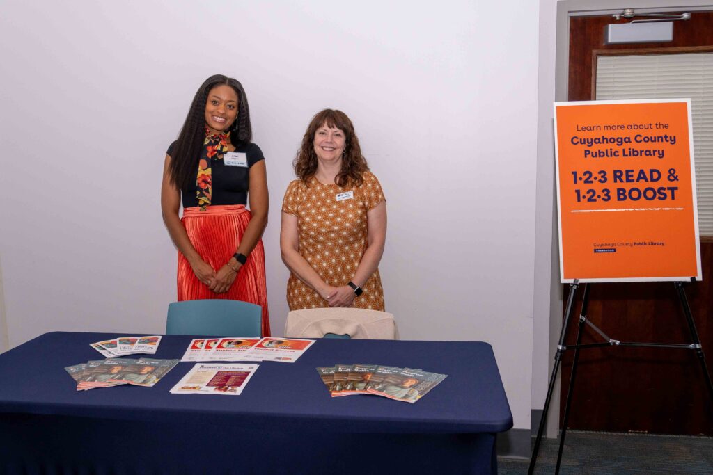 CCPL employees stand at a table with literature ready to great guests and tell them about 123 READ and 123 BOOST.
