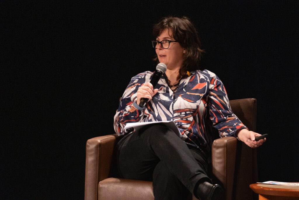 Kate Merlene speaks to an audience.