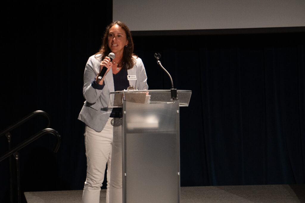 Special Events Committee Chair Lisa Mayers welcomes attendees to the Book Buzz.