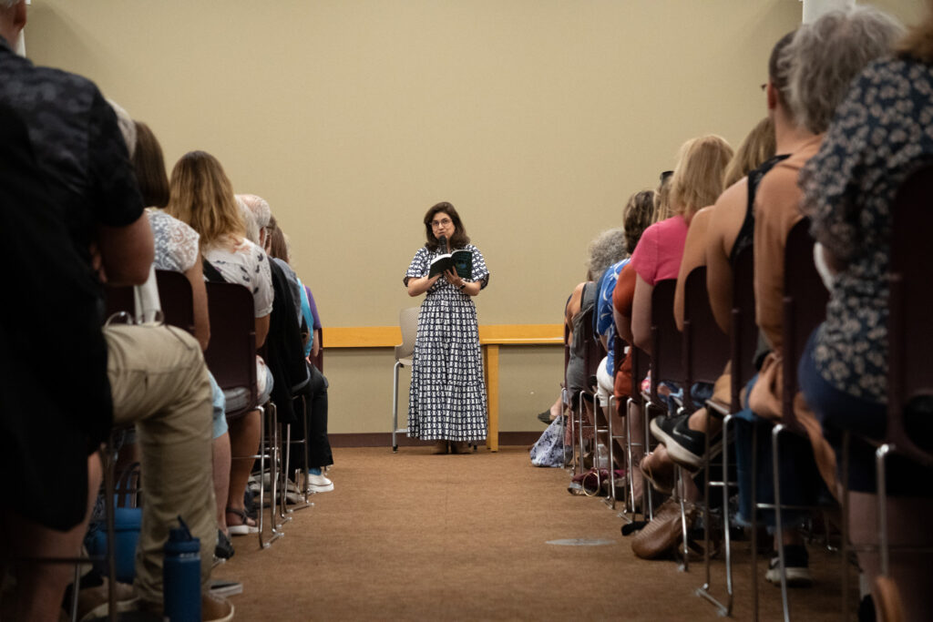 Author Marjan Kamali speaks to an audience.